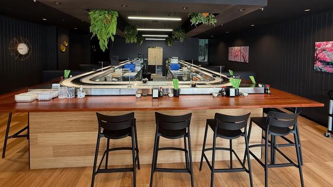 The Lesslie's have transformed the Adelaide St shop front they are leasing into a sushi train.