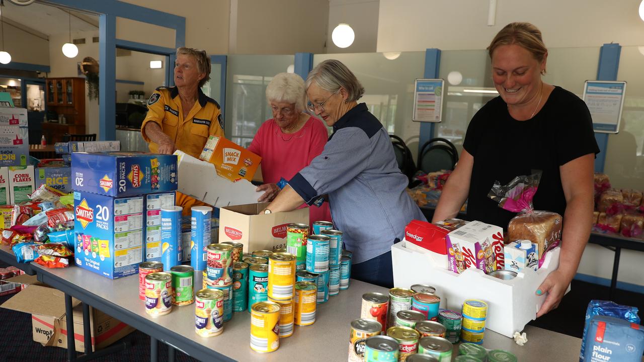 RFS volunteers Rebecca Andrews, Noelene Hitchcock, Robin Hitchcock and Andrea Pateman RFS put food packs together from donated goods at the Wisemans Ferry Bowling Club.