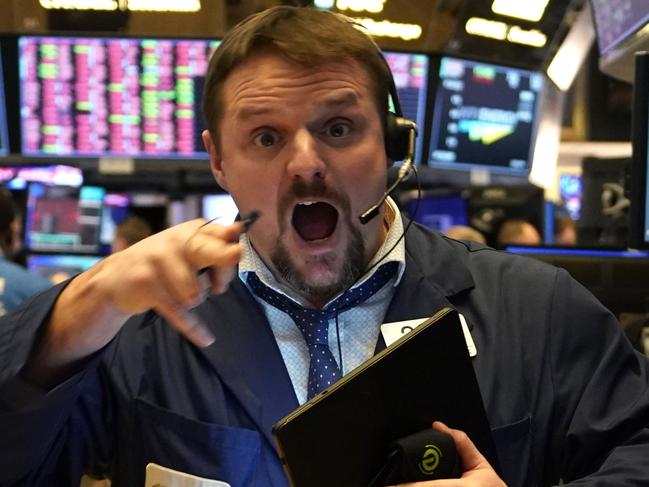 CORRECTION - Traders work during the closing bell at the New York Stock Exchange (NYSE) on March 9, 2020 on Wall Street in New York City. - Major Wall Street indices finished down more than seven percent following an ugly session sparked by an oil price crash and fears over the economic fallout from the coronavirus. At the end of a day-long rout, the benchmark Dow Jones Industrial Average was at 23,851.02, a loss of more than 2,000 points or 7.8 percent, making it the worst session since December 2008. (Photo by TIMOTHY A. CLARY / AFP) / “The erroneous mention[s] appearing in the metadata of this photo by TIMOTHY A. CLARY has been modified in AFP systems in the following manner: [down more then 2000 points] instead of [down more then 200 points]. Please immediately remove the erroneous mention[s] from all your online services and delete it (them) from your servers. If you have been authorized by AFP to distribute it (them) to third parties, please ensure that the same actions are carried out by them. Failure to promptly comply with these instructions will entail liability on your part for any continued or post notification usage. Therefore we thank you very much for all your attention and prompt action. We are sorry for the inconvenience this notification may cause and remain at your disposal for any further information you may require.”