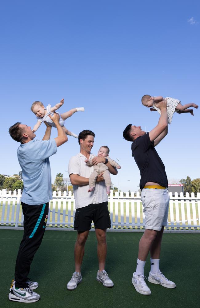 Cricket dads Marnus Labuschagne and daughter Hallie, Mitch Swepson and son Beau and Matthew Renshaw and daughter Charlotte ahead of their first Father's Day. Picture: David Kelly