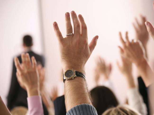 Business lecture, hands up. Man. Watch. Married. Ring. Generic image.