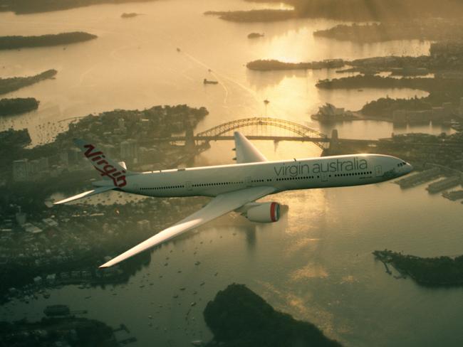 A Virgin Australia plane flying over Sydney Harbour at sunrise. Tourism Australia and Virgin Australia team up to target Americans watching the Oscars.   Picture: Supplied