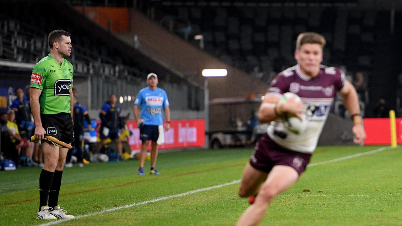 Touch judge Liam Kennedy holds his ground to indicate a forward pass to Sea Eagles winger Reuben Garrick in 2020. Picture: AAP Image/Dan Himbrechts