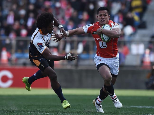 TOKYO, JAPAN - FEBRUARY 24:  Hosea Saumaki of the Sunwolves takes on the defence of Henry Speight of the Brumbies during the Super Rugby round 2 match between Sunwolves and Brumbies at the Prince Chichibu Memorial Ground on February 24, 2018 in Tokyo, Japan.  (Photo by Matt Roberts/Getty Images for Sunwolves)