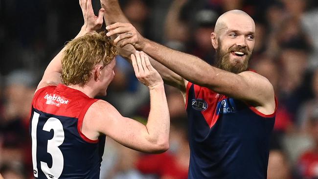 MELBOURNE, AUSTRALIA - APRIL 16: Max Gawn of the Demons is congratulated by Clayton Oliver after kicking a goal during the round five AFL match between the Melbourne Demons and the Greater Western Sydney Giants at Melbourne Cricket Ground on April 16, 2022 in Melbourne, Australia. (Photo by Quinn Rooney/Getty Images)