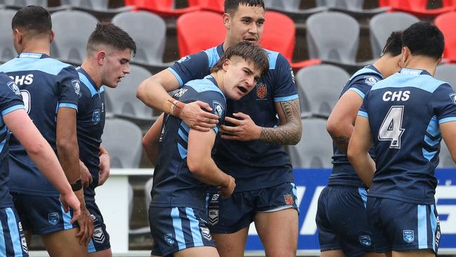 NSW CHS players celebrate Chevy Stewart’s try at the ASSRL Championships at Redcliffe. Picture: Liam Kidston