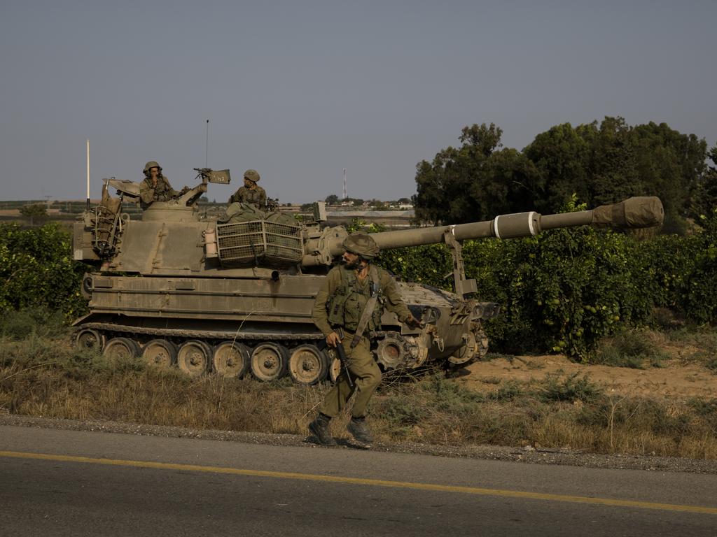 Armoured vehicles head towards the southern border with Gaza on October 8, 2023, in Sderot, Israel. Picture: Amir Levy/Getty Images