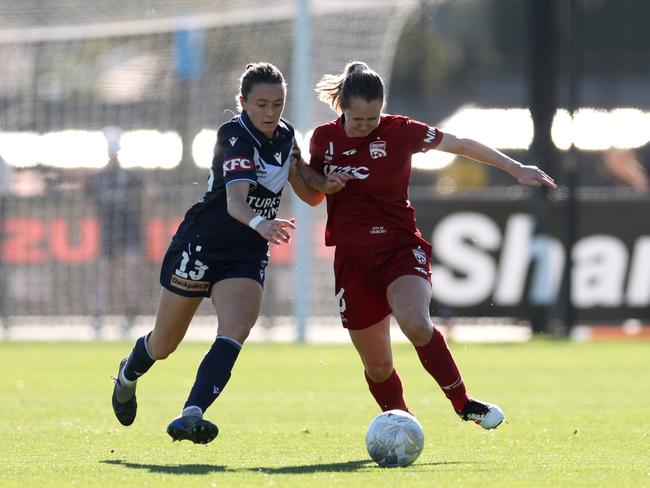 Melbourne Victory’s Sara D'Appolonia and Adelaide United’s Dylan Holmes contest possession. Picture: Getty Images