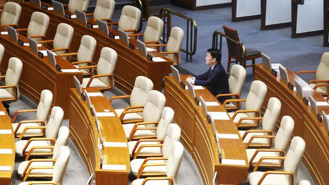 Lawmaker Ahn Chul-soo sits alone, the only People Power Party lawmaker to remain in the voting chamber during the plenary session for the impeachment vote of President Yoon Suk Yeol at the National Assembly in Seoul. Picture: AFP