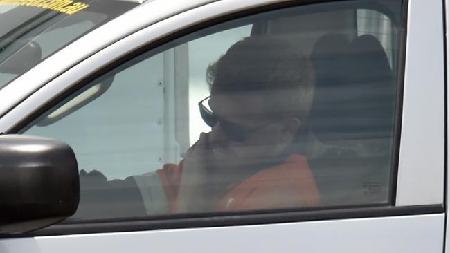 A Townsville tradie takes a call while driving. Picture: Evan Morgan