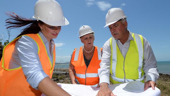 L-R Brittany Lauga, Michelle Landry and Bill Ludwig look over plans for the upgrade to the Scenic Highway near Statue Bay in 2018.