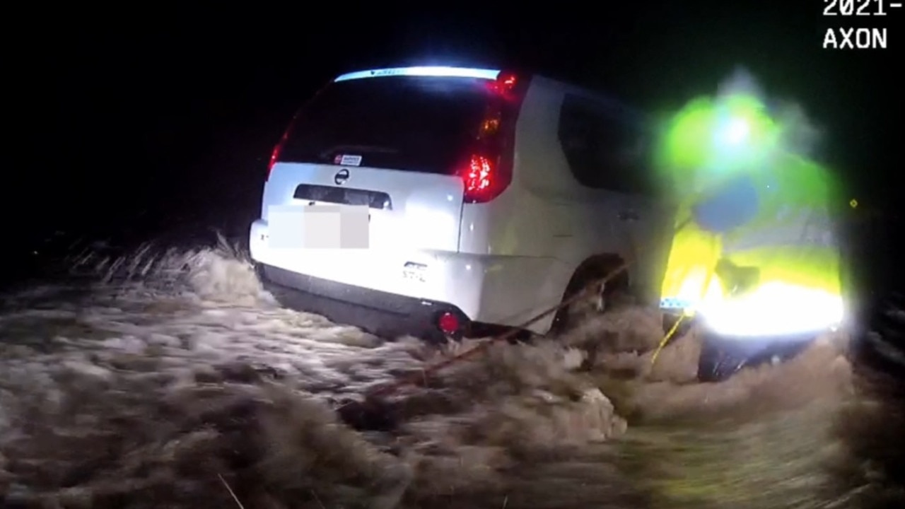 Warwick drivers are being warned to avoid flooded roads after two dramatic rescues from floodwaters overnight.