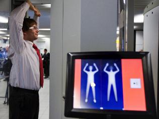 Full-body scanner trial begins at Canberra Airport - ABC News