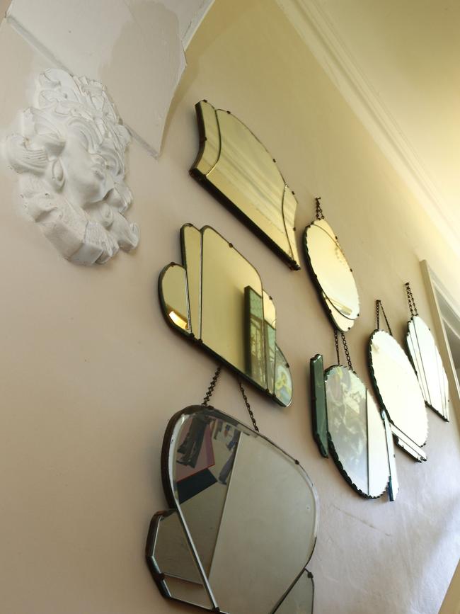 Art deco era mirrors line the stairwell. Picture: John Appleyard