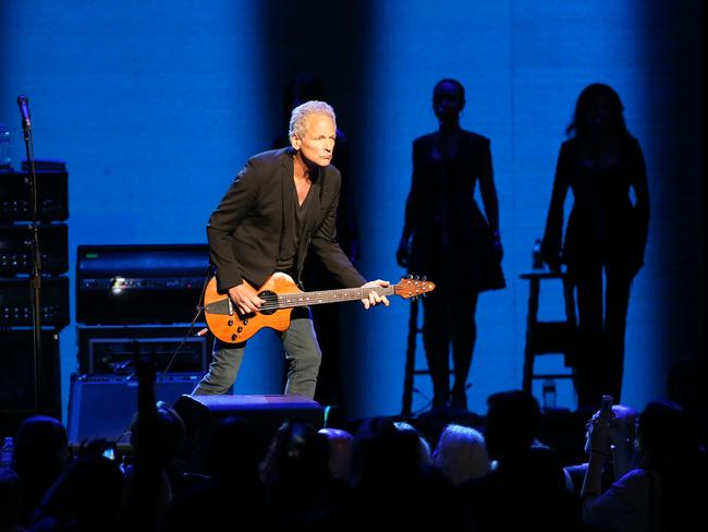 Fleetwood Mac performing in Sydney, Lindsey Buckingham - lead guitar, rhythm guitar, vocals, Stevie Nicks - vocals, tambourine, Christine McVie - vocals, keyboards, maracas, accordion on 