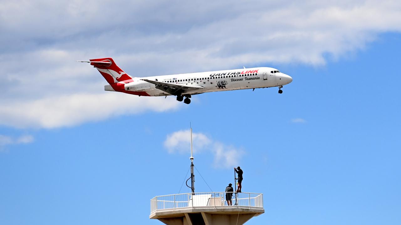 SYDNEY, AUSTRALIA - NewsWire Photos NOVEMBER 3, 2022: A QantasLink plane prepares to land at Sydney Domestic Airport. Picture: NCA NewsWire / Jeremy Piper