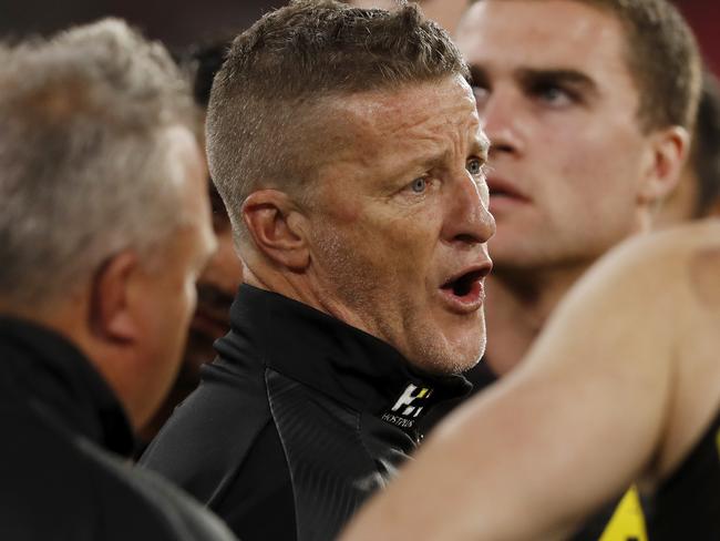 MELBOURNE, AUSTRALIA - APRIL 24: Damien Hardwick, Senior Coach of the Tigers addresses his players during the 2021 AFL Round 06 match between the Melbourne Demons and the Richmond Tigers at the Melbourne Cricket Ground on April 24, 2021 in Melbourne, Australia. (Photo by Dylan Burns/AFL Photos via Getty Images)