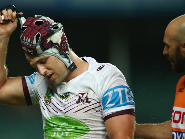 Jamie Buhrer looks dejected as he leaves the field with an injury against the Roosters