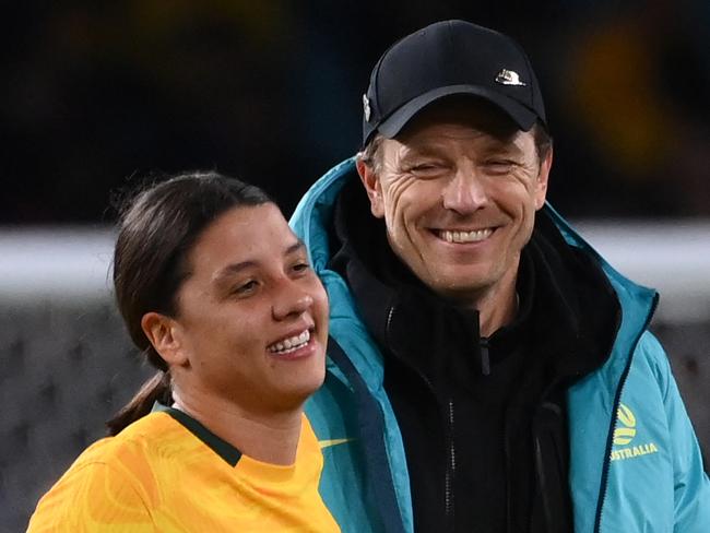 Australia's coach Tony Gustavsson (R) greets Australia's forward #20 Sam Kerr at the end of the Australia and New Zealand 2023 Women's World Cup round of 16 football match between Australia and Denmark at Stadium Australia in Sydney on August 7, 2023. (Photo by FRANCK FIFE / AFP)