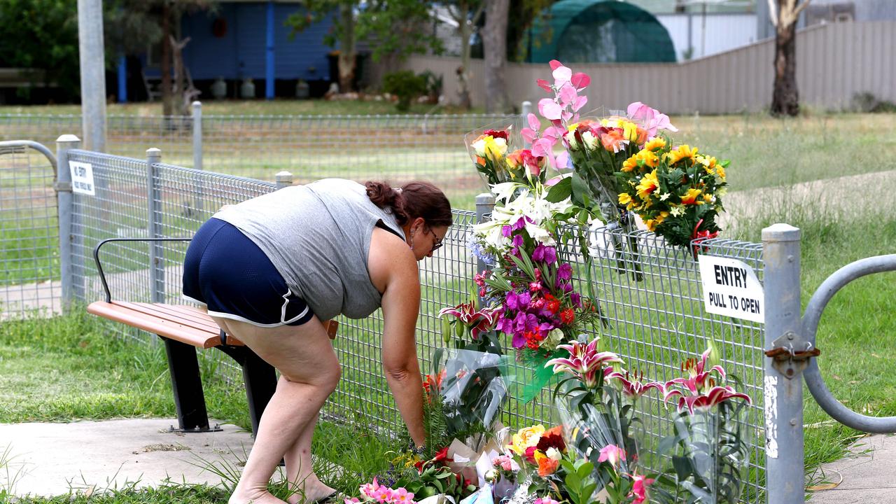 She lay flowers and tributes at the Tara Police Station where a makeshift memorial has been established Picture: NCA NewsWire/ David Clark