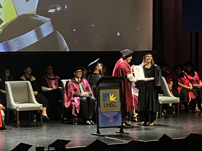 Graduates from the University of the Sunshine Coast's Fraser Coast campus celebrating at the Brolga Theatre.