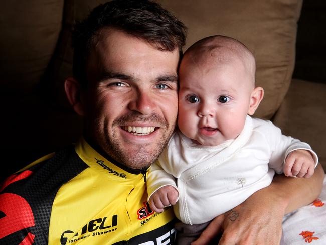 CYCLING - Jack Bobridge at home with baby daughter Amellie before competing in the Tour Down Under. Photo Sarah Reed.