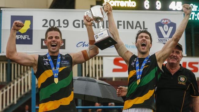 Rikki Johnson (left) celebrates Dromana’s 2019 premiership. Picture: Valeriu Campan