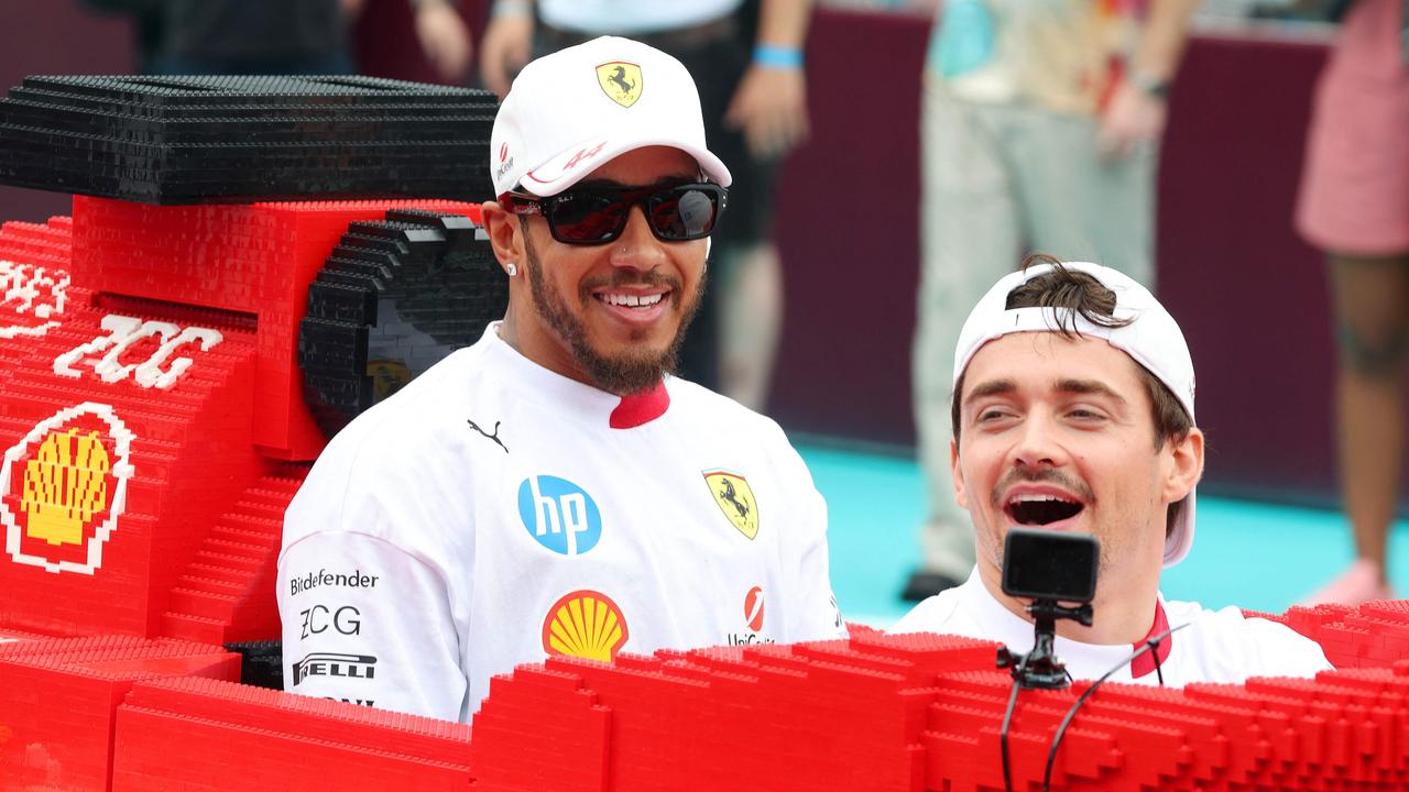 Ferrari’s Lewis Hamilton and Charles Leclerc in their Lego Ferrari. Photo: Mark Thompson/Getty Images/AFP.