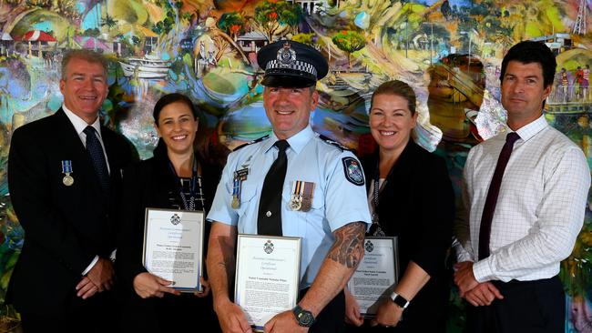 QPS officers and staff members were presented with medals and awards at a ceremony held at the Upper Coomera Community Centre. Pictured: Detective Superintendent Brian Swan, Senior Constable Kelly Abrams, Senior Constable Nick White, Senior Constable Marie Sawtell and Detective Senior Sergeant Simon Garrett Picture: David Clark