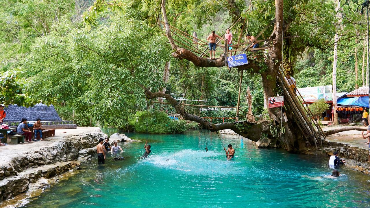The pair visited the Blue lagoon in Vang Vieng, Laos, but knew things were taking a turn for the worse when they couldn’t use their arms to swim. Picture: Alamy