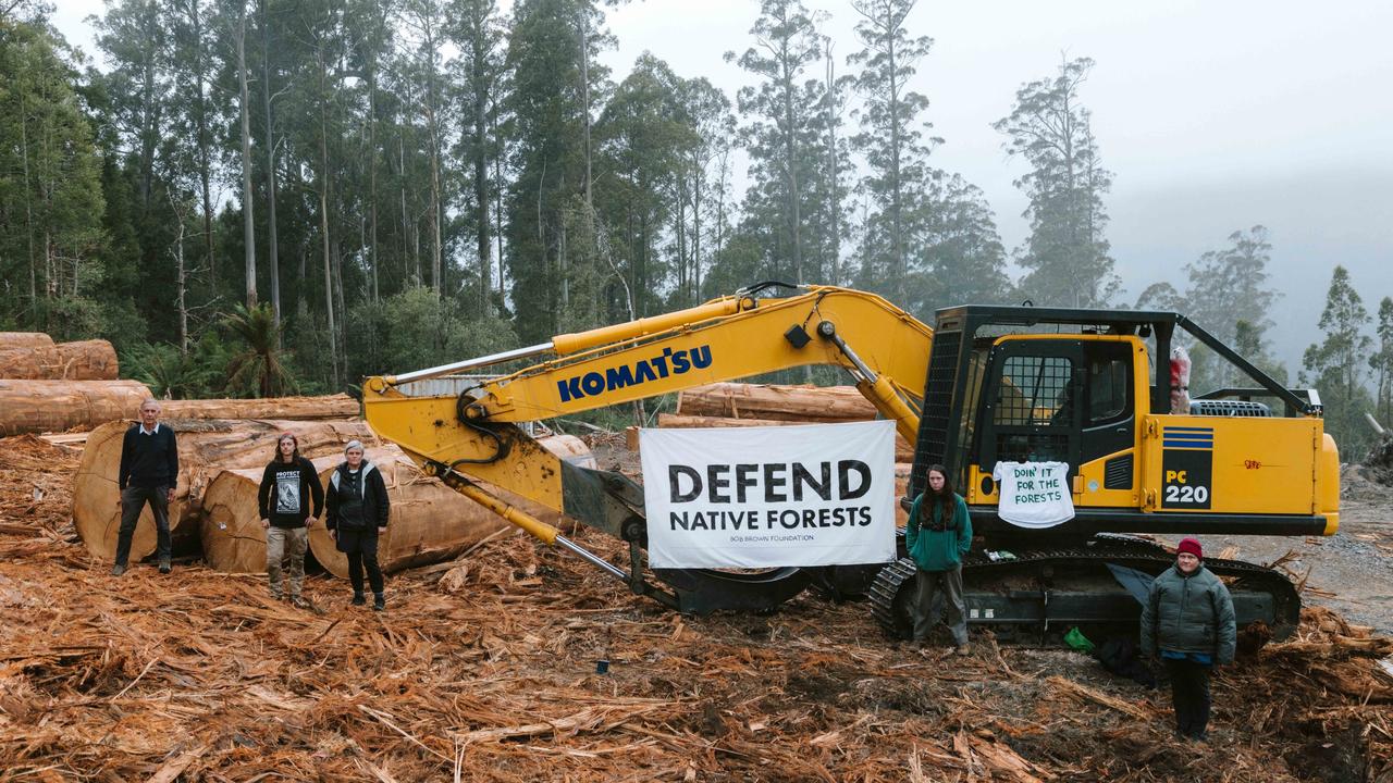 Protesters surround logging equipment in a logging coupe in Tasmania. 40,000 hectares previously earmarked for protection will be available for logging under new plans. Picture: Handout via NCA NewsWire