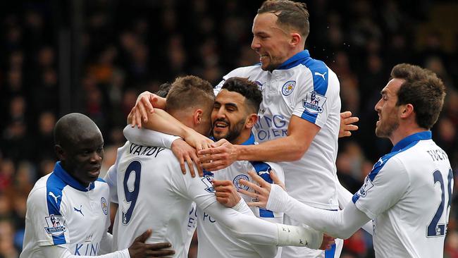 Leicester City's Riyad Mahrez (3rd R) celebrates after scoring his team's first goal during the English Premier League football match between Crystal Palace and Leicester City at Selhurst Park in south London on March 19, 2016. / AFP PHOTO / IKIMAGES / IKimages / RESTRICTED TO EDITORIAL USE. No use with unauthorized audio, video, data, fixture lists, club/league logos or 'live' services. Online in-match use limited to 45 images, no video emulation. No use in betting, games or single club/league/player publications. /