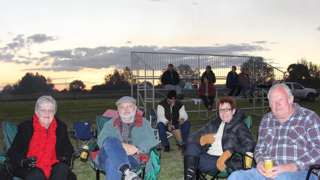 Sue and Trevor Tyson from Mt Tamborine and Trena and Ross Johnson from Tewantin relax around one of the fire drums at the Killarney Bonfire and Fire Drum Night on Saturday, July 27, 2013. Photo: John Towells / Warwick Daily News