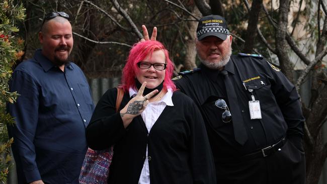 Ashley Christmas, Daniel Langmead and a supporter enjoy a joke and a laugh outside Mt Barker Magistrate Court. Pictures/Russell Millard