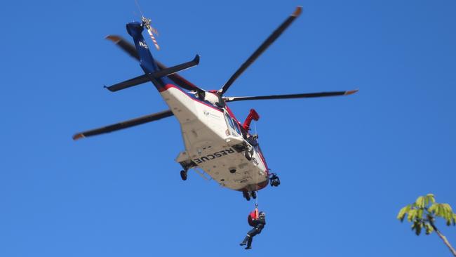 The Rescue 510 chopper is deployed to Emerald Creek Falls to take a 19-year-old Mareeba woman to hospital. Photo: Bronwyn Wheatcroft