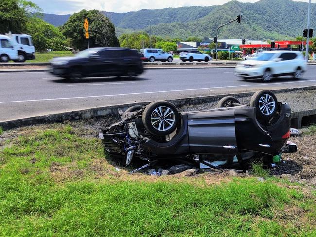 Division 2 councillor Matt Tickner would like to see the state and federal governments fast track the master plan for the Bruce Highway intersection at Robert and Swallow  Road in Bentley Park, the location of two fatal accidents in the past month. An upturned car sits crashed on the Swallow Road side of the intersection. Picture: Brendan Radke