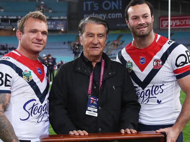 Jake Friend and Boyd Cordner with Roosters chairman Nick Politis who is worth about $2 billion. Picture. Phil Hillyard