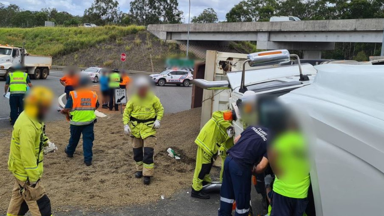 Seriously Injured Truckie Freed After Bruce Hwy Rollover | The Courier Mail