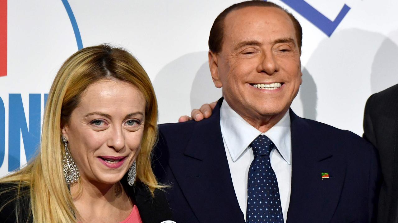 Giorgia Meloni, President of Brothers of Italy party, is now predicted to win the snap election. SHe is pictured with former leader Silvio Berlusconi Picture: AFP PHOTO / Alberto PIZZOLI