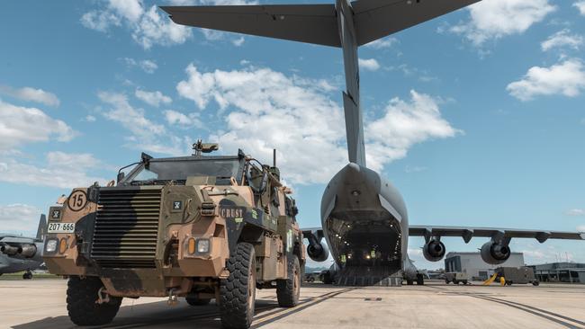 An Australian Army Bushmaster is loaded onto a Royal Australian Air Force C-17A Globemaster III.