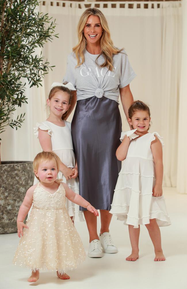 Candice Warner with her daughters Isla, 16 months, Ivy, 6, and Indi, 4, at the Grace Loves Lace Sydney headquarters. Picture: Justin Lloyd.