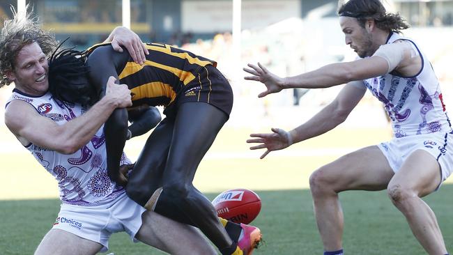 LAUNCESTON, AUSTRALIA - JULY 10: Changkuoth Jiath of the Hawks is tackled by David Mundy of the Dockers during the round 17 AFL match between Hawthorn Hawks and Fremantle Dockers at University of Tasmania Stadium on July 10, 2021 in Launceston, Australia. (Photo by Daniel Pockett/AFL Photos/via Getty Images)