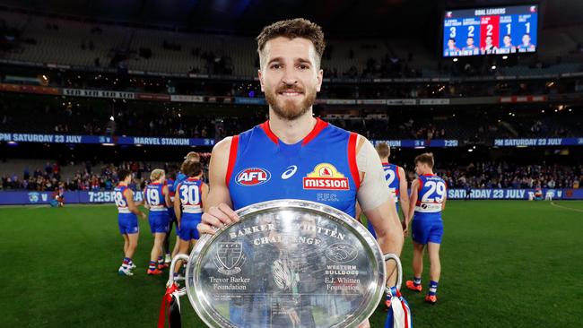 Marcus Bontempelli poses with the only silverware either side is likely to win. Photo by Dylan Burns/AFL Photos via Getty Images