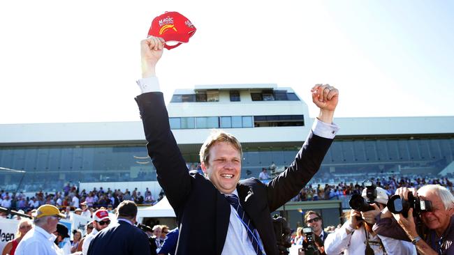 Trainer Bjorn Baker celebrates the win of Unencumbered in the Magic Millions 2YO Classic on the Gold Coast in 2014. Photo: Adam Head