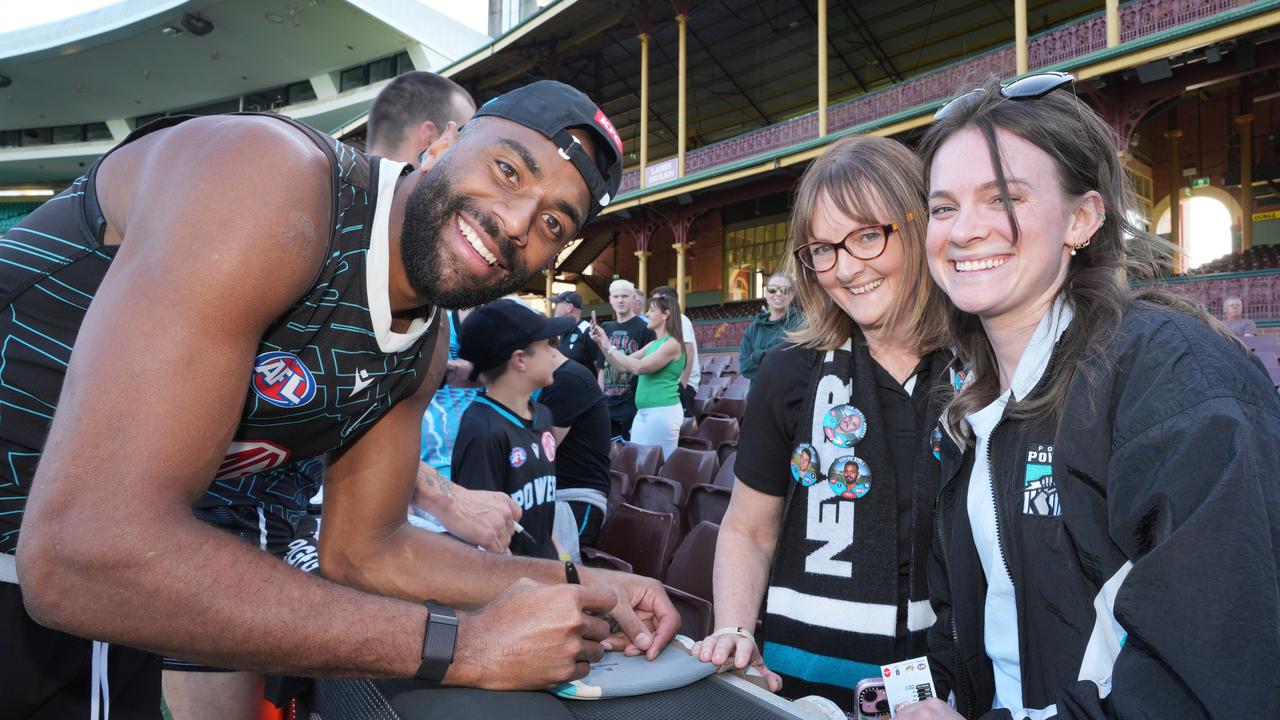 Port player Esava Ratogulea, with Port fans in Sydney. Picture: Dean Martin