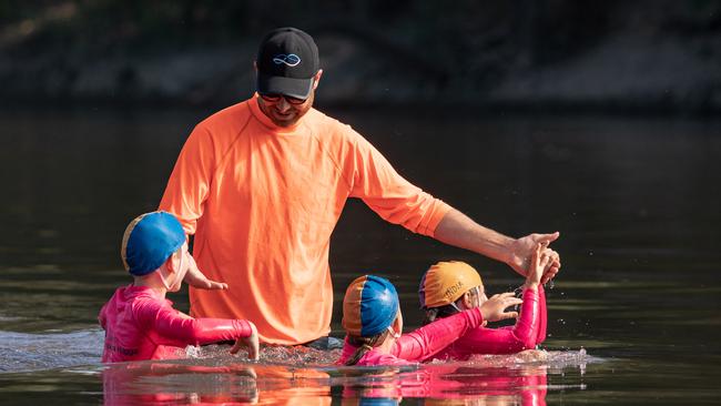 Children performing life saving drills at the Wagga Beach on the Murrumbidgee River. Picture: Simon Dallinger