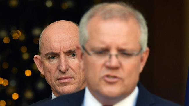 NDIS Minister Stuart Robert watches as Scott Morrison announces extra funding for aged care. Picture: AAP