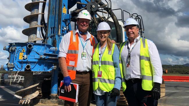 Gold Coast Airport Chief Operating Officer Marion Charlton is flanked by Carl Bruhn (right) and Lendlease Senior Site Manager Dave Clark in front of the piling rig used to start work on the airport’s new aerobridges as part of the Southern Terminal Expansion project.