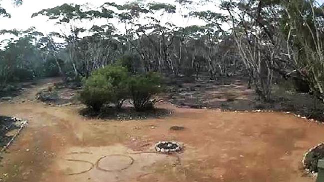 An SOS written on a driveway by Deborah Pilgrim after becoming lost in the Sedan area. Picture: SA Police