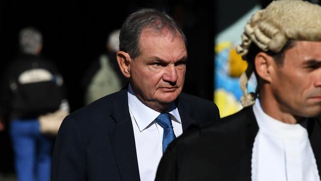 Former Ipswich mayor Paul Pisasale (left) arriving at the District Court in Brisbane in July, 2019 (AAP Image/Dan Peled)